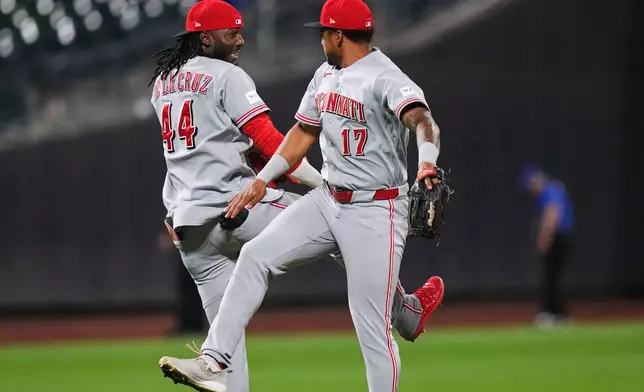 Cincinnati Reds' Elly de la Cruz (44) celebrates with Dane Myers (17) after a baseball game against the New York Mets Tuesday, May 26, 2026, in New York. (AP Photo/Frank Franklin II)