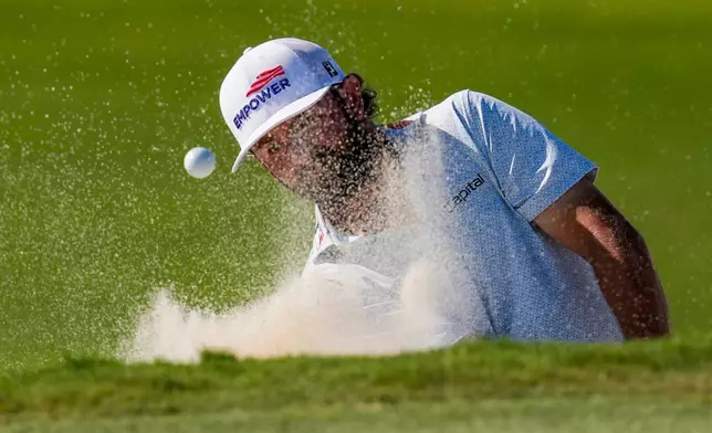 Cameron Young hits from the 16th green bunker during the third round of the Cadillac Championship PGA golf tournament Saturday, May 2, 2026, in Doral, Fla. (AP Photo/David J. Phillip)