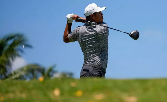 Si Woo Kim, of South Korea, hits from the eighth tee during the third round of the Cadillac Championship PGA golf tournament Saturday, May 2, 2026, in Doral, Fla. (AP Photo/David J. Phillip)