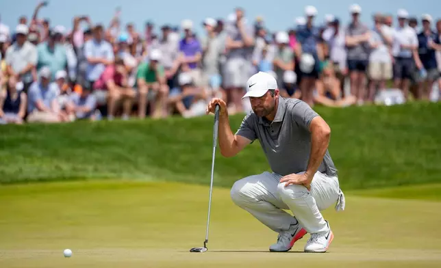 Scottie Scheffler lines up his shot on the seventh green during the final round of the PGA Championship golf tournament at Aronimink Golf Club, Sunday, May 17, 2026, in Newtown Square, PA. (AP Photo/Carolyn Kaster)