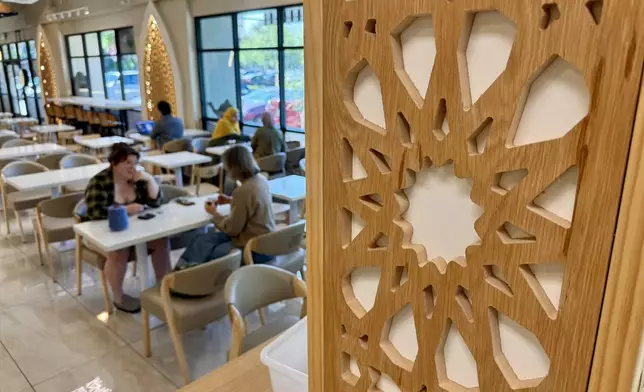 Customers are seen inside Arwa Yemeni Coffee on April 6, 2026, in Sunnyvale, Calif. (AP Photo/Haven Daley)
