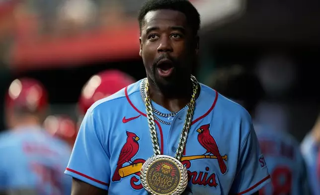 St. Louis Cardinals' Jordan Walker celebrates in the dugout after hitting a three-run homer during the sixth inning of the second baseball game of a doubleheader against the Cincinnati Reds in Cincinnati, Saturday, May 23, 2026. (AP Photo/Carolyn Kaster)