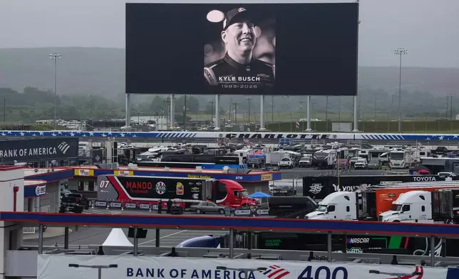 An in memoriam photo of former driver Kyle Busch is displayed on the video board of the backstretch at Charlotte Motor Speedway, Friday, May 22, 2026, in Charlotte, N.C. (AP Photo/Matt Kelley)