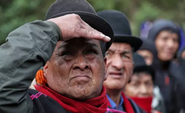 Misak Indigenous guards patrol after deadly clashes with the Nasa community over a land dispute in Silvia, Colombia, Friday, May 22, 2026.(AP Photo/Santiago Saldarriaga)