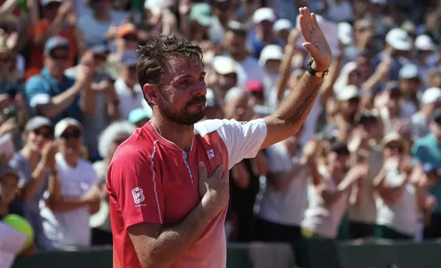 Stan Wawrinka of Switzerland reacts after the first round men's singles tennis match against Jesper De Jong of the Netherlands at the French Open tennis tournament in Paris, Monday, May 25, 2026. (AP Photo/Thibault Camus)