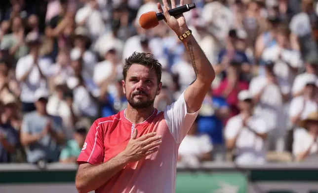 Stan Wawrinka of Switzerland reacts after the first round men's singles tennis match against Jesper De Jong of the Netherlands at the French Open tennis tournament in Paris, Monday, May 25, 2026. (AP Photo/Thibault Camus)