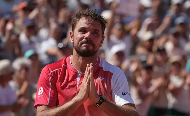 Stan Wawrinka of Switzerland reacts after the first round men's singles tennis match against Jesper De Jong of the Netherlands at the French Open tennis tournament in Paris, Monday, May 25, 2026. (AP Photo/Thibault Camus)