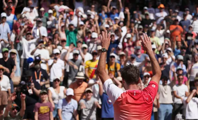 Stan Wawrinka of Switzerland waves to fans after the first round men's singles tennis match against Jesper De Jong of the Netherlands at the French Open tennis tournament in Paris, Monday, May 25, 2026. (AP Photo/Thibault Camus)