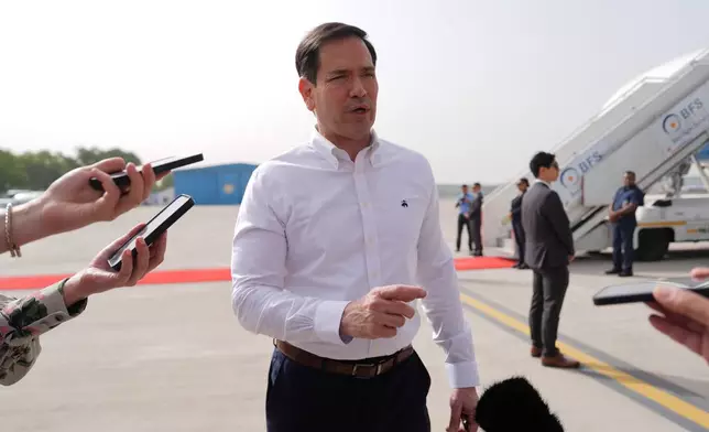 United States Secretary of State Marco Rubio speaks to the journalists before boarding his plane at Indira Gandhi International Airport in New Delhi, India, Monday, May 25, 2026. (AP Photo/Julia Demaree Nikhinson, Pool)
