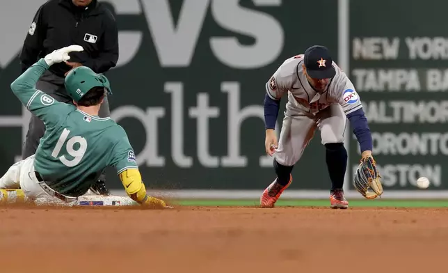 Boston Red Sox designated hitter Roman Anthony, left, slides safely into second base as Houston Astros second baseman Jose Altuve, right, fields the ball during the fifth inning of a baseball game Friday, May 1, 2026, in Boston. (AP Photo/Mark Stockwell)