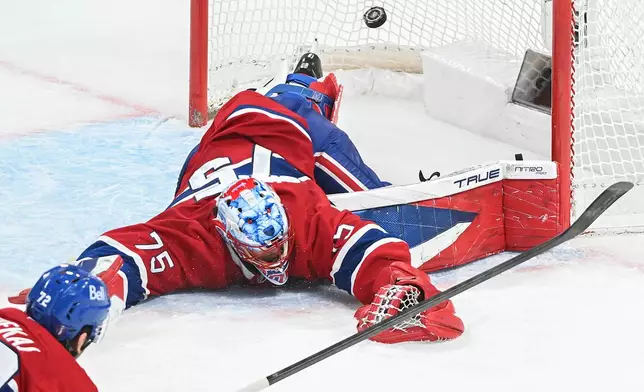 Montreal Canadiens goaltender Jakub Dobes is scored against by Buffalo Sabres' Konsta Helenius during the second period of Game 6 in a second-round NHL hockey Stanley Cup playoff series in Montreal, Saturday, May 16, 2026. (Graham Hughes/The Canadian Press via AP)