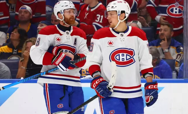 Montreal Canadiens right wing Zachary Bolduc, right, celebrates after his goal with defenseman Mike Matheson (8) during the first period in Game 7 of a second-round NHL hockey Stanley Cup playoff series against the Buffalo Sabres, Monday, May 18, 2026, in Buffalo, N.Y. (AP Photo/Jeffrey T. Barnes)