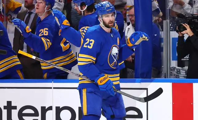 Buffalo Sabres defenseman Mattias Samuelsson (23) celebrates after his goal during the second period in Game 7 of a second-round NHL hockey Stanley Cup playoff series against the Montreal Canadiens, Monday, May 18, 2026, in Buffalo, N.Y. (AP Photo/Jeffrey T. Barnes)