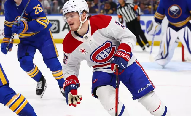 Montreal Canadiens right wing Cole Caufield, right, skates out of the zone during the second period in Game 7 of a second-round NHL hockey Stanley Cup playoff series against the Buffalo Sabres Monday, May 18, 2026, in Buffalo, N.Y. (AP Photo/Jeffrey T. Barnes)