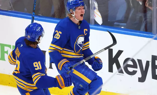 Buffalo Sabres defenseman Rasmus Dahlin (26) celebrates after his goal during the third period in Game 7 of a second-round NHL hockey Stanley Cup playoff series against the Montreal Canadiens, Monday, May 18, 2026, in Buffalo, N.Y. (AP Photo/Jeffrey T. Barnes)