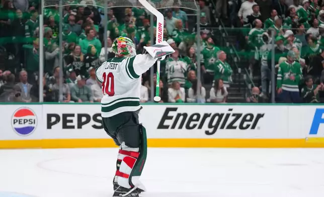 Minnesota Wild goaltender Jesper Wallstedt reacts to an open net goal by teammate left wing Kirill Kaprizov against the Dallas Stars during the third period in Game 5 of a first-round NHL Stanley Cup playoffs hockey series, Tuesday, April 28, 2026, in Dallas. (AP Photo/Julio Cortez)