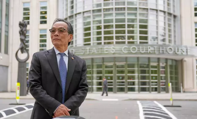 Lu Jianwang waits to enter a federal courthouse in New York, Wednesday, May 6, 2026. (AP Photo/Seth Wenig)