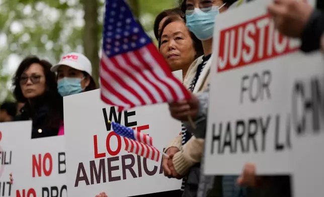 Supporters of Lu Jianwang, also known as Harry Lu, stand outside a federal courthouse before the opening of his trial in New York, Wednesday, May 6, 2026. (AP Photo/Seth Wenig)