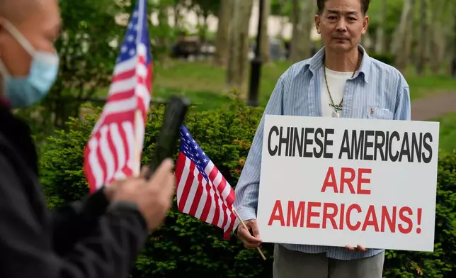 Supporters of Lu Jianwang, also known as Harry Lu, stand outside a federal courthouse before the opening of his trial in New York, Wednesday, May 6, 2026. (AP Photo/Seth Wenig)