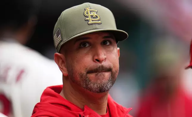 St. Louis Cardinals manager Oliver Marmol looks up into the stands at fans as they cheer and wave their shirts above their heads during the fourth inning of a baseball game between the St. Louis Cardinals and the Kansas City Royals Saturday, May 16, 2026, in St. Louis. (AP Photo/Jeff Roberson)