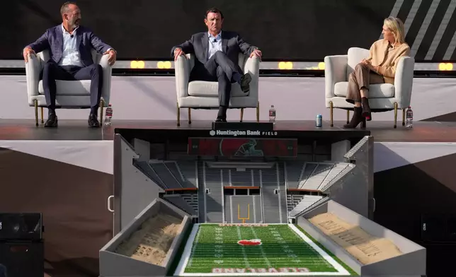 Executives of the Haslam Sports Management Group, from left, Dave Jenkins, JW Johnson and Whitney Haslam Johnson speak during a panel discussion during groundbreaking ceremonies for the new Cleveland Browns stadium in Brook Park, Ohio, Thursday, April 30, 2026. (AP Photo/Sue Ogrocki)