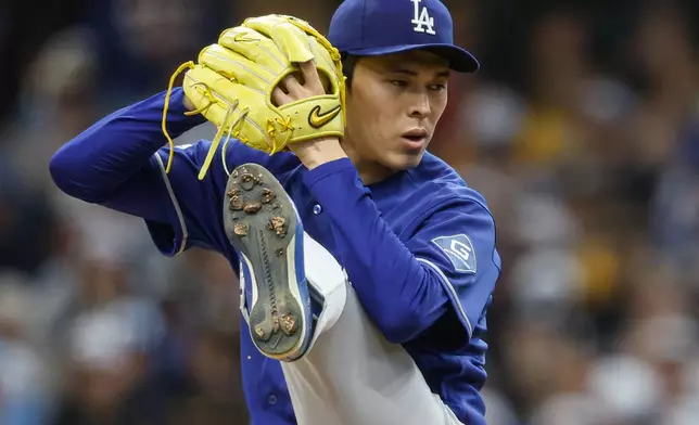 Los Angeles Dodgers pitcher Roki Sasaki throws to the Milwaukee Brewers during the first inning of a baseball game, Saturday, May 23, 2026, in Milwaukee. (AP Photo/Jeffrey Phelps)
