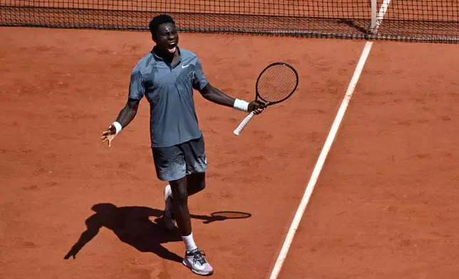 Moise Kouame of France reacts as he plays against Adolfo Daniel Vallejo of Paraguay during their second round men's singles tennis match at the French Open tennis tournament in Paris, Thursday, May 28, 2026. (AP Photo/Emma Da Silva)