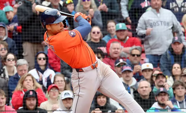 Houston Astros' Cam Smith hits for a single allowing two runners to score during the tenth inning of a baseball game against the Boston Red Sox, Sunday, May 3, 2026, in Boston. (AP Photo/Mark Stockwell)