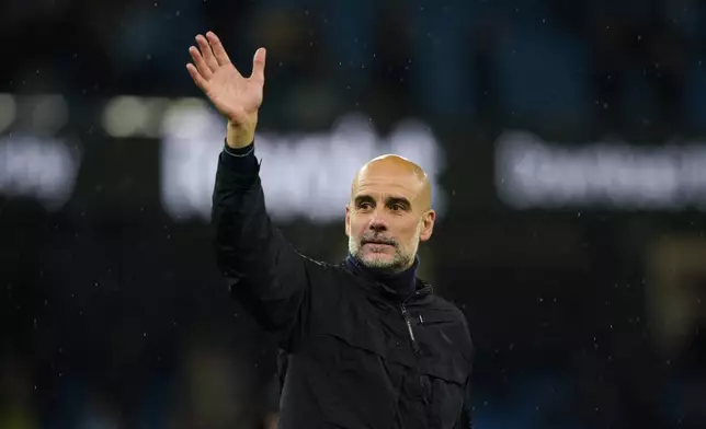 Manchester City's head coach Pep Guardiola greets fans at the end of the English Premier League soccer match between Manchester City and Crystal Palace in Manchester, England, Wednesday, May 13, 2026. (AP Photo/Ian Hodgson)