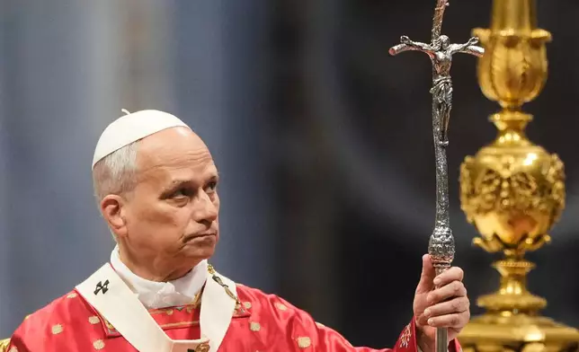 Pope Leo XIV holds the pastoral staff as he celebrates the Pentecost Mass in St. Peter's Basilica, at the Vatican, Sunday, May 24, 2026. (AP Photo/Gregorio Borgia)