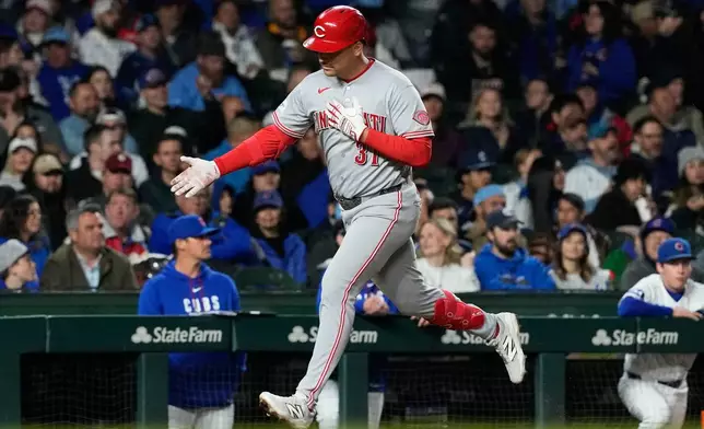 Cincinnati Reds' Nathaniel Lowe celebrates as he rounds the bases after hitting a solo home run during the sixth inning of a baseball game against the Chicago Cubs in Chicago, Tuesday, May 5, 2026. (AP Photo/Nam Y. Huh)
