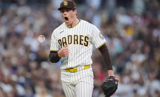 San Diego Padres pitcher Mason Miller celebrates after the Padres defeated the St. Louis Cardinals 4-2 in a baseball game Saturday, May 9, 2026, in San Diego. (AP Photo/Gregory Bull)