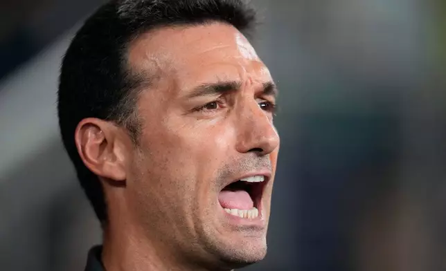 FILE - Argentina's coach Lionel Scaloni sings his national anthem prior to the Copa America final soccer match against Colombia in Miami Gardens, Fla., July 14, 2024. (AP Photo/Julio Cortez, File)