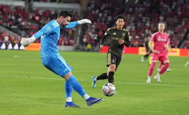 St. Louis City goalkeeper Roman Bürki, left, clears the ball as Los Angeles FC's Son Heung-Min watches during the first half of an MLS soccer match Wednesday, May 13, 2026, in St. Louis. (AP Photo/Jeff Roberson)