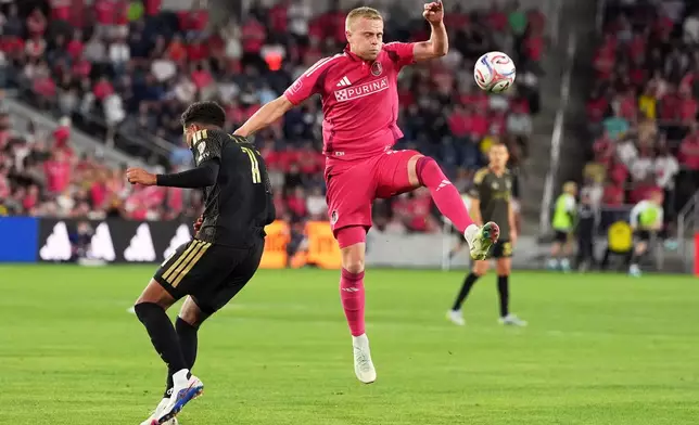 St. Louis City's Tomas Totland, right, and Los Angeles FC's Timothy Tillman battle for the ball during the first half of an MLS soccer match Wednesday, May 13, 2026, in St. Louis. (AP Photo/Jeff Roberson)