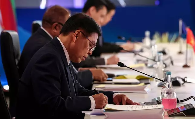 Thailand's Foreign Minister Sihasak Phuangketkeow takes a note as he attends the Association of Southeast Asian Nations (ASEAN) Foreign Ministers' Meeting ahead of the 48th ASEAN Summit and Related Meetings in Cebu, Philippines, Thursday, May 7, 2026. (Eloisa Lopez/Pool Photo via AP)