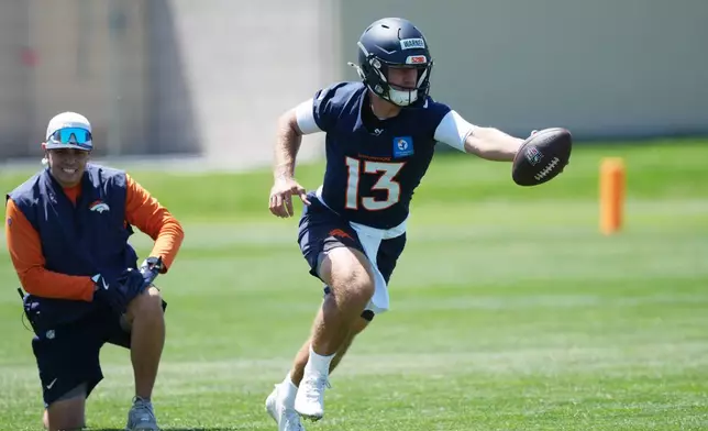Denver Broncos quarterback E.J. Warner takes part in drills at the NFL football team's rookie minicamp Saturday, May 9, 2026, at the team's headquarters in Centennial, Colo. (AP Photo/David Zalubowski)