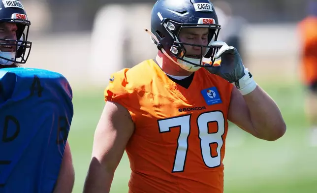 Denver Broncos offensive lineman Kage Casey takes a break during drills at the NFL football team's rookie minicamp, Saturday, May 9, 2026, at the team's headquarters in Centennial, Colo. (AP Photo/David Zalubowski)