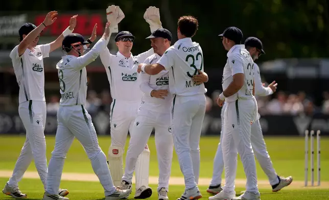 Ireland's Mark Adair celebrates bowling out New Zealand's Tom Latham on day one of the International Test Match between Ireland and New Zealand, in Belfast, Ireland, Wednesday May 27, 2026. (Niall Carson/PA via AP)