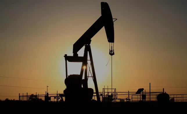 FILE - A pump jack operates at sunset in the Permian Basin near Loving, N.M., on Tuesday, May 20, 2025. (AP Photo/Susan Montoya Bryan, file)