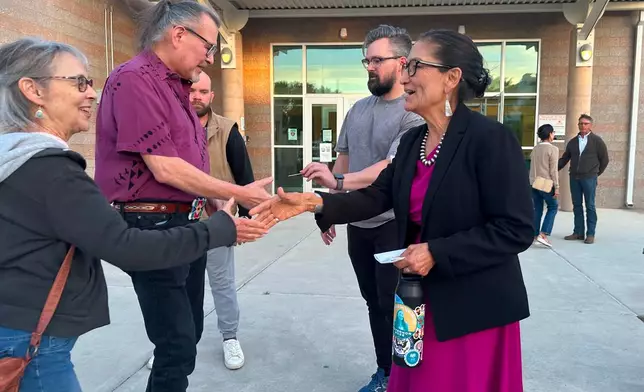 Former U.S. Interior Secretary Deb Haaland, a Democratic candidate for governor of New Mexico, greets people outside a candidate forum in Rio Rancho, N.M., on April 28, 2026, ahead of a June 2 primary election. (AP Photo/Morgan Lee)