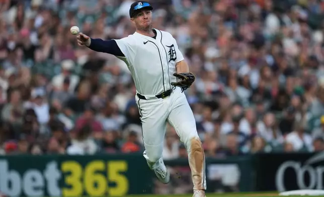 Detroit Tigers third baseman Colt Keith throws to first base for an out against the Los Angeles Angels during the fifth inning of a baseball game Wednesday, May 27, 2026, in Detroit. (AP Photo/Paul Sancya)