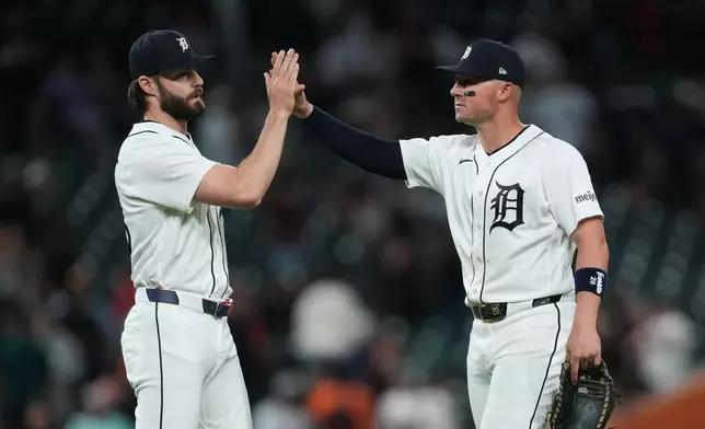 Detroit Tigers pitcher Brenan Hanifee, left, and Spencer Torkelson, right, celebrate after the final out against the Los Angeles Angels during the ninth inning of a baseball game Wednesday, May 27, 2026, in Detroit. (AP Photo/Paul Sancya)
