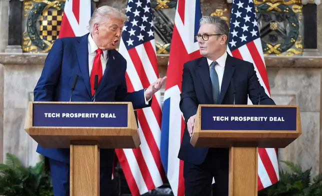FILE - President Donald Trump gestures next to Britain's Prime Minister Keir Starmer during a joint press conference at Chequers near Aylesbury, England, on Sept. 18, 2025. (AP Photo/Evan Vucci, File)