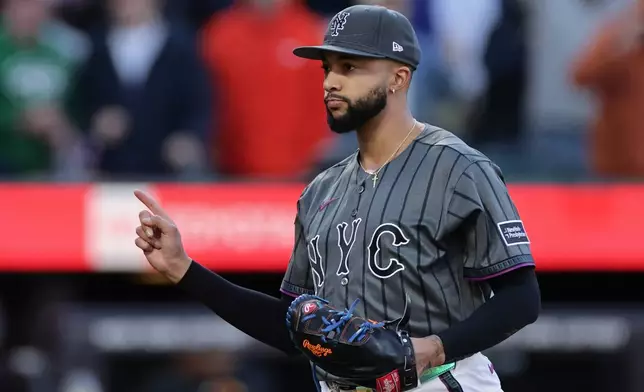 New York Mets pitcher Devin Williams reacts after the final out against the Miami Marlins during the ninth inning of a baseball game Saturday, May 30, 2026, in New York. (AP Photo/Adam Hunger)