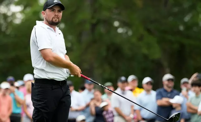 Alex Fitzpatrick, of England, hits from the third tee during third round of the Truist Championship golf tournament at the Quail Hollow Club, Saturday, May 9, 2026, in Charlotte, N.C. (AP Photo/Chris Carlson)