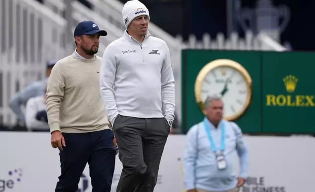 Matt Fitzpatrick, right, and Alex Fitzpatrick walk down the ninth hole during practice before the PGA Championship golf tournament at the Aronimink Golf Club Monday, May 11, 2026, in Newtown Square, Pa. (AP Photo/Matt Slocum)