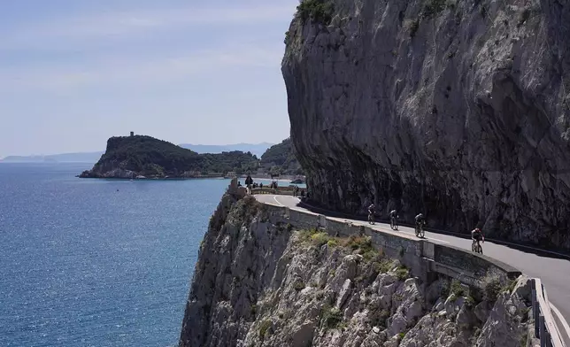 The pack rides during the 12th stage of the Giro d'Italia cycling race, from Imperia to Novi Ligure, Italy, Thursday, May 21, 2026. (Marco Alpozzi/LaPresse via AP)