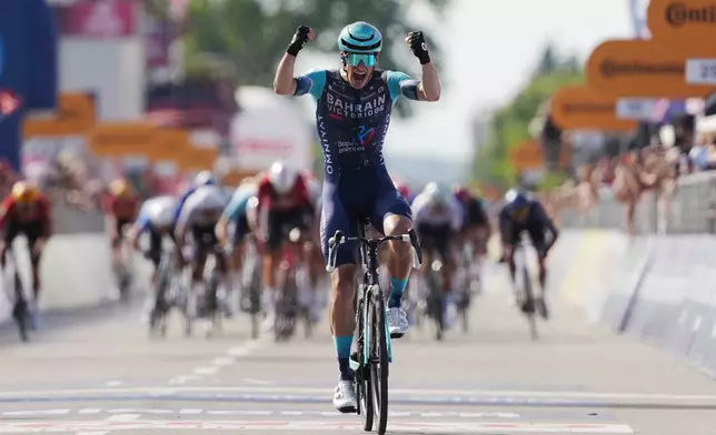 Belgium's Alec Segaert of Bahrain Victorious crosses the finish line to win the 12th stage of the Giro d'Italia cycling race, from Imperia to Novi Ligure, Italy, Thursday, May 21, 2026. (Massimo Paolone/LaPresse via AP)