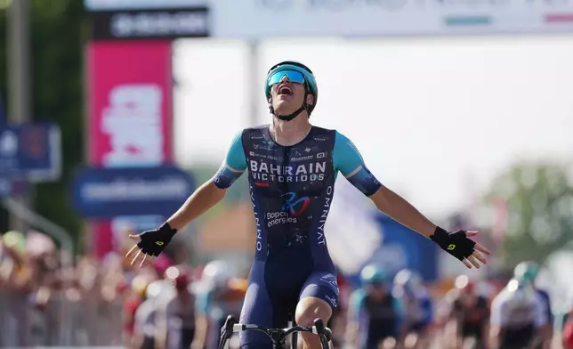Belgium's Alec Segaert of Bahrain Victorious crosses the finish line to win the 12th stage of the Giro d'Italia cycling race, from Imperia to Novi Ligure, Italy, Thursday, May 21, 2026. (Massimo Paolone/LaPresse via AP)